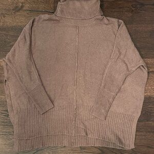 Turtleneck sweater with open sides